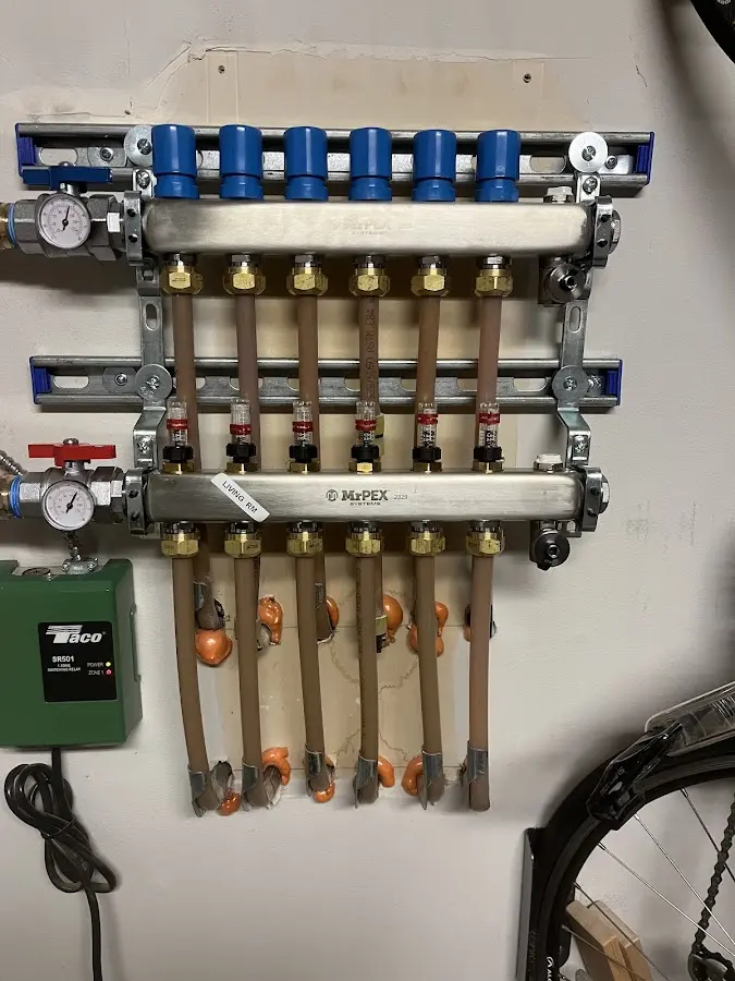 Plumber performing Water Heater Repair at a residential property in Bonadelle Ranchos